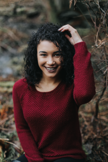 Forest portrait of girl with green eyes, curly hair and red sweater in the pacific northwest, PNW, Kitsap County. Silverdale, bremerton, port orchard, poulsbo, gig harbor, Bainbridge island, washinton state.